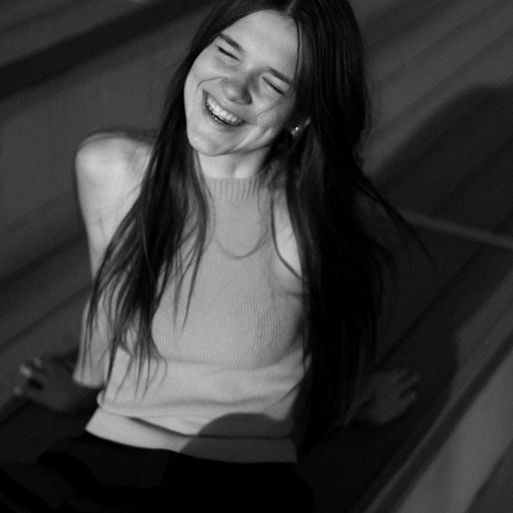 Kaveri Mehta, Lead Design Curator at ArchiveLeafPark, reviewing corporate floral arrangements